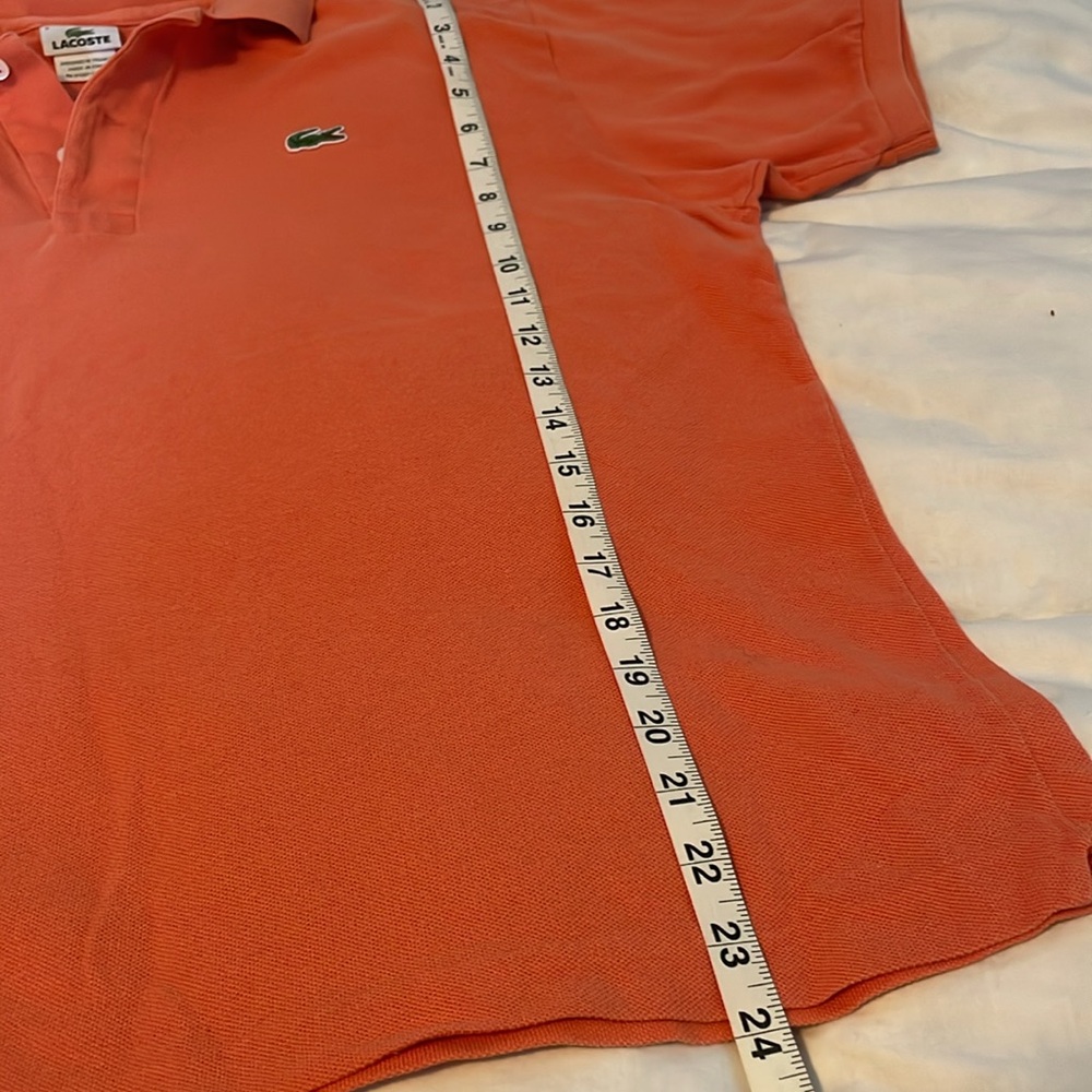 Lacoste polo in coral/pastel orange. Size 6 measures 23 in across/24 in length - Picture 4 of 4